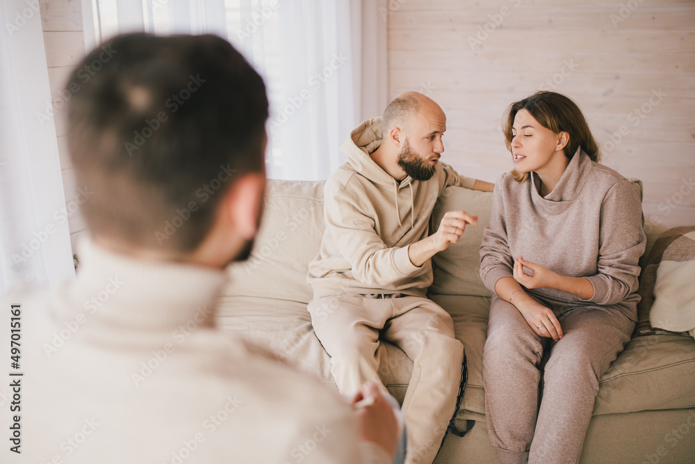 Psychiatrist consulting couple that have problems in their relationship. Mental support session. Psychiatrist consulting couple that have problems in their relationship. Mental support session.