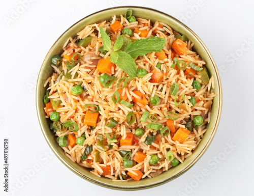 Schezwan Fried Rice is a popular indo-chinese food served in a plate or bowl with authentic sausages. selective focus