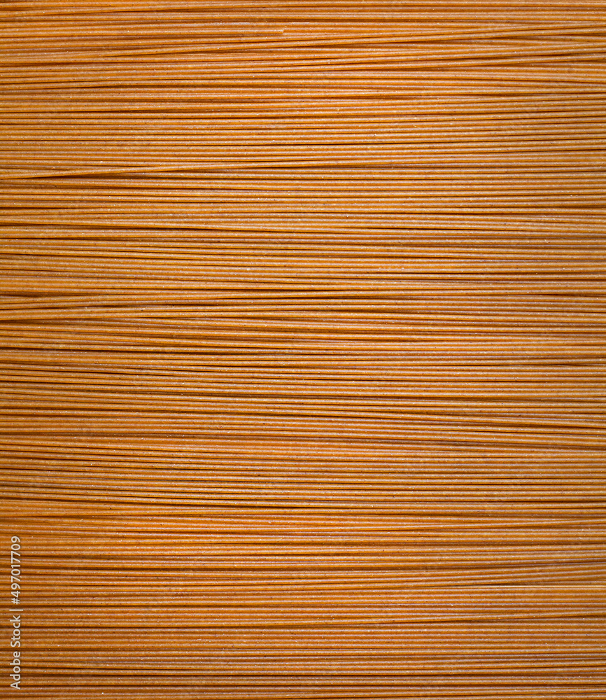 abstract brown background from pasta straws abstract brown background from pasta straws