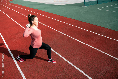 Pregnancy exercise. Pregnant woman training yoga sport exercise. Prenatal healthy fitness active fit gym outside. Pregnancy running.
