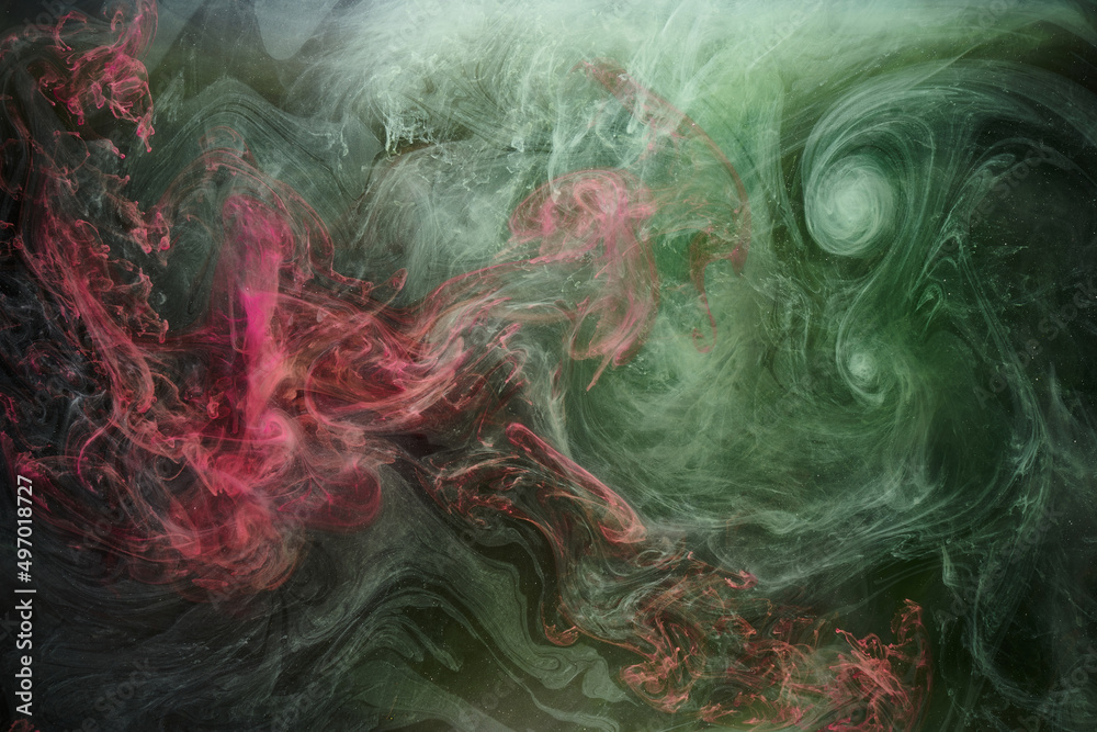 Obraz premium Green pink smoke on black ink background, colorful fog, abstract swirling touch ocean sea, acrylic paint pigment underwater