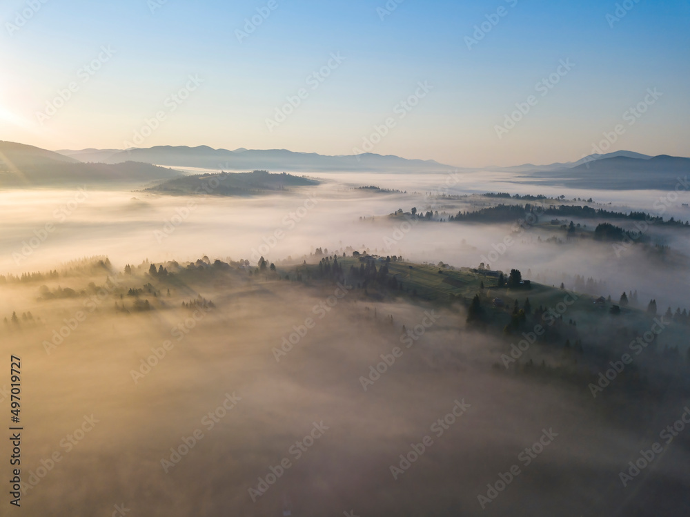Morning fog in the Ukrainian Carpathians. Aerial drone view. Morning fog in the Ukrainian Carpathians. Aerial drone view.