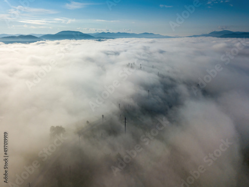 Morning fog in the Ukrainian Carpathians. Aerial drone view.