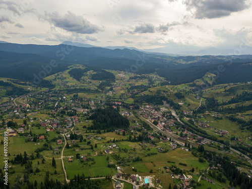 Settlement in the mountains of the Ukrainian Carpathians. Aerial drone view.