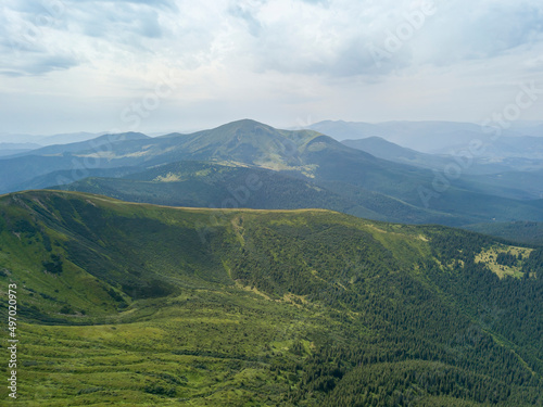 High mountains of the Ukrainian Carpathians in cloudy weather. Aerial drone view.