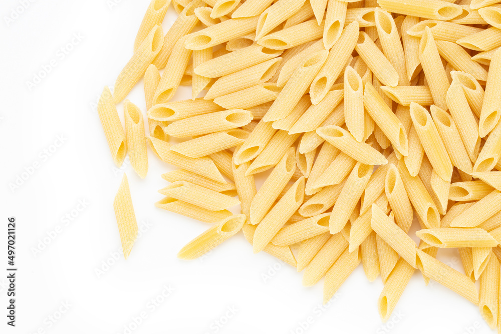 Pennette rigate. Raw pasta on white background. Space for text. Pennette rigate. Raw pasta on white background. Space for text.