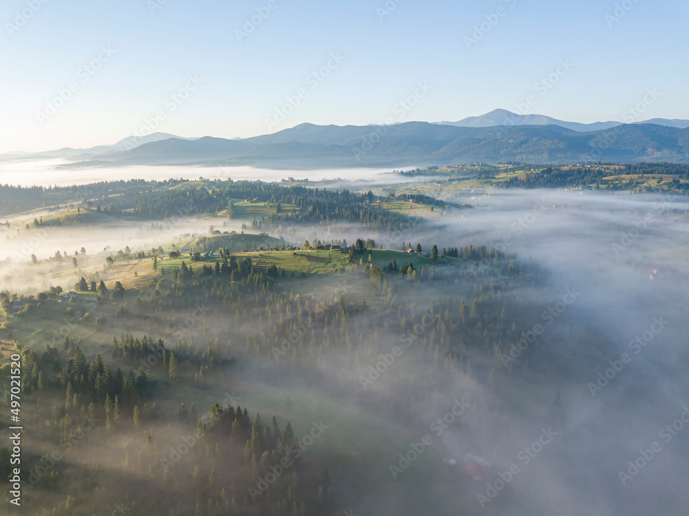 Morning fog in the Ukrainian Carpathians. Aerial drone view.