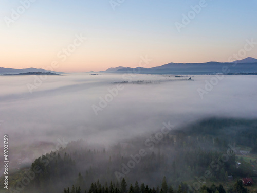 Morning fog in the Ukrainian Carpathians. Aerial drone view.