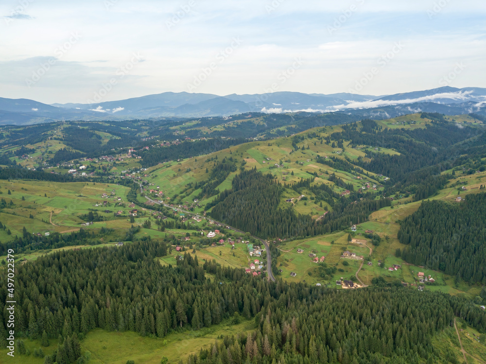 Green mountains of Ukrainian Carpathians in summer. Aerial drone view.