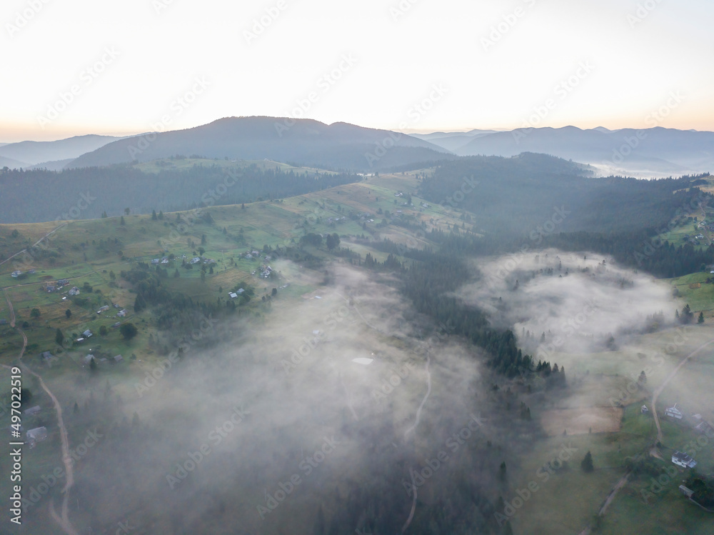 Fototapeta premium Morning fog in the Ukrainian Carpathians. Aerial drone view.