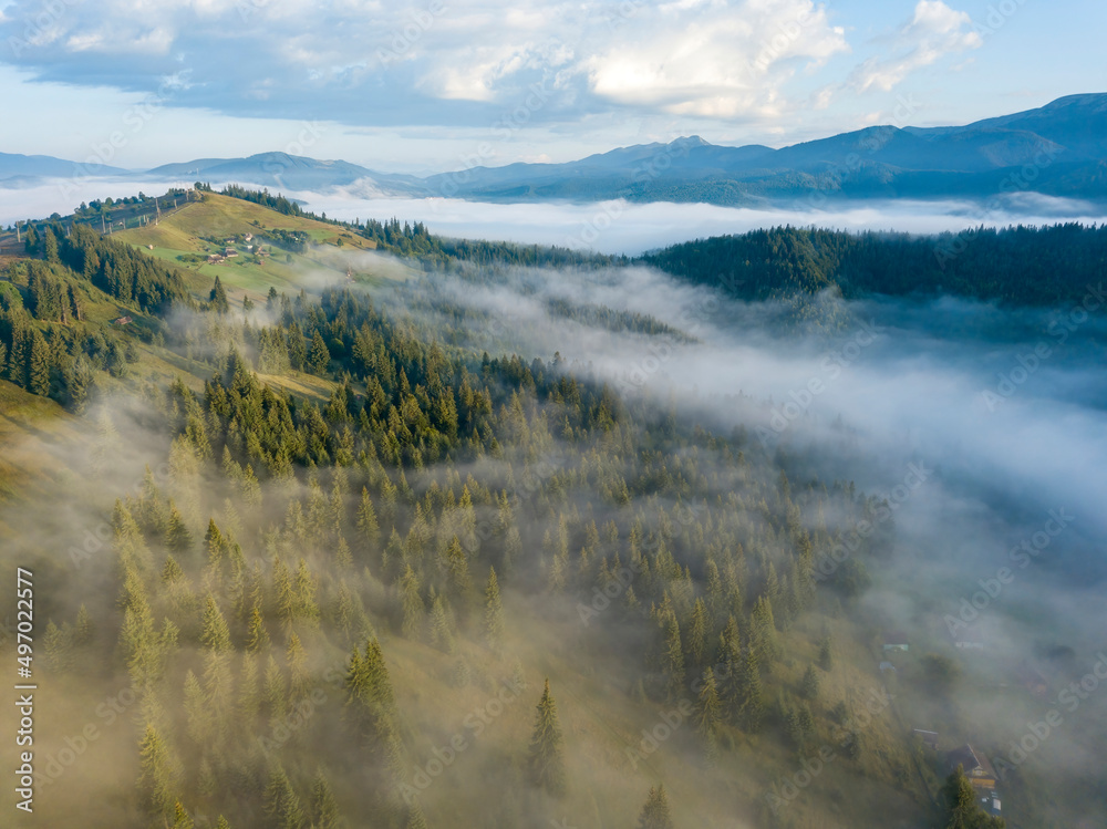 Green mountains of the Ukrainian Carpathians in the morning fog. Aerial drone view. Green mountains of the Ukrainian Carpathians in the morning fog. Aerial drone view.