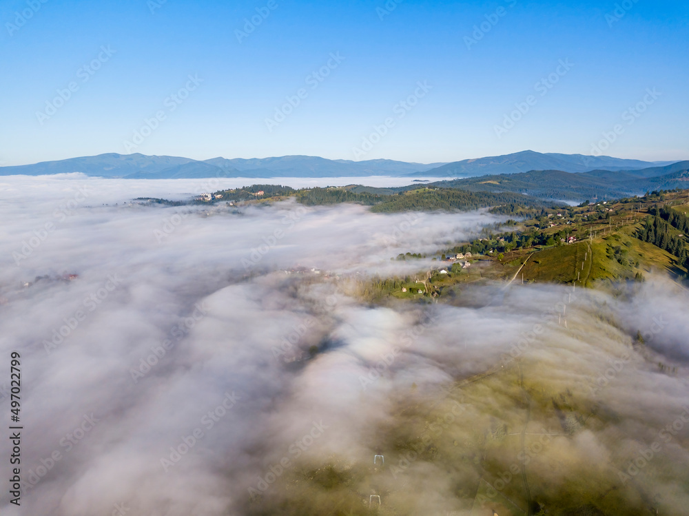 Morning fog in the Ukrainian Carpathians. Aerial drone view.