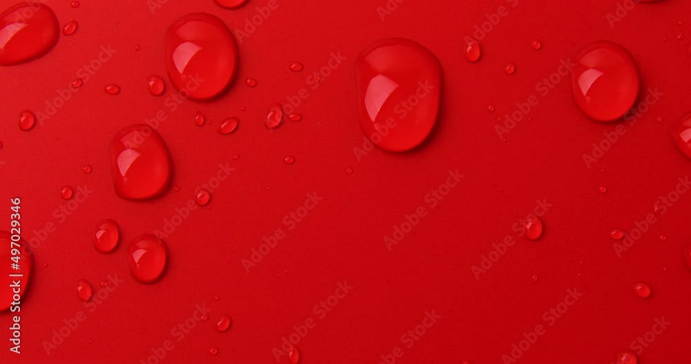 Abstract water drops on red background, macro, Bubbles close up, Cosmetic liquid drops, Flat lay pattern. Abstract water drops on red background, macro, Bubbles close up, Cosmetic liquid drops, Flat lay pattern.