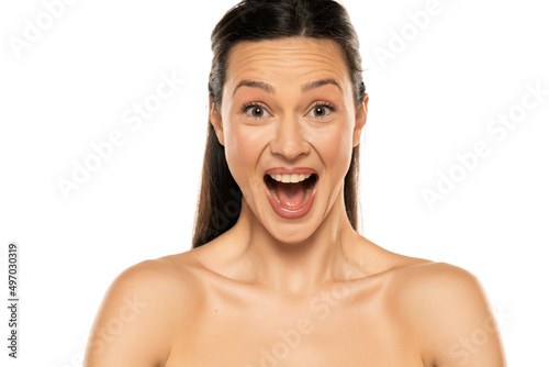 Portrait of shirtless happy surpriseed woman on a white background © vladimirfloyd