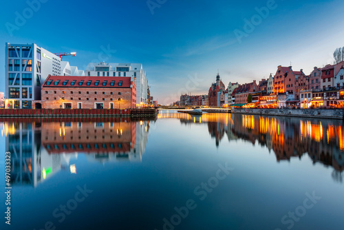 Beautiful architecture of Gdansk old town reflected in the Motlawa river at dusk  Poland