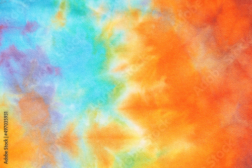 Abstract tie dye multicolor fabric cloth Boho pattern texture for background or groovy wedding card, sale flyer, 60s, 70s poster, kid tie-dye diy backdrop. Modern Watercolor Wet Brush Fabrics Art photo
