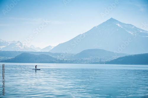 Standup Paddler in front of Niesen on Lake Thun