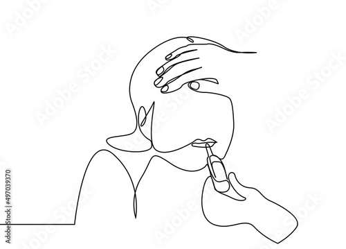 a person taking the temperature of a sick girl