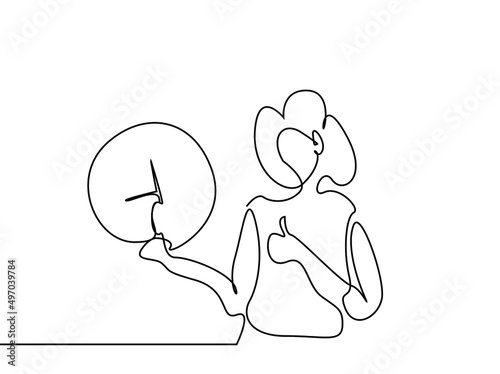 a punctual disciplined person shows the clock and laughs and makes the nice sign