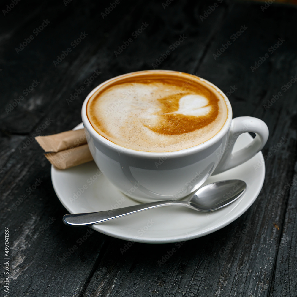 cup of coffee on a wooden black table
cup of coffee on a wooden black table