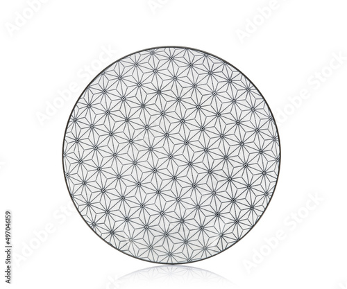 Plate on a white isolated background. View from above. Small flat round plate. © Тарас Квакуш