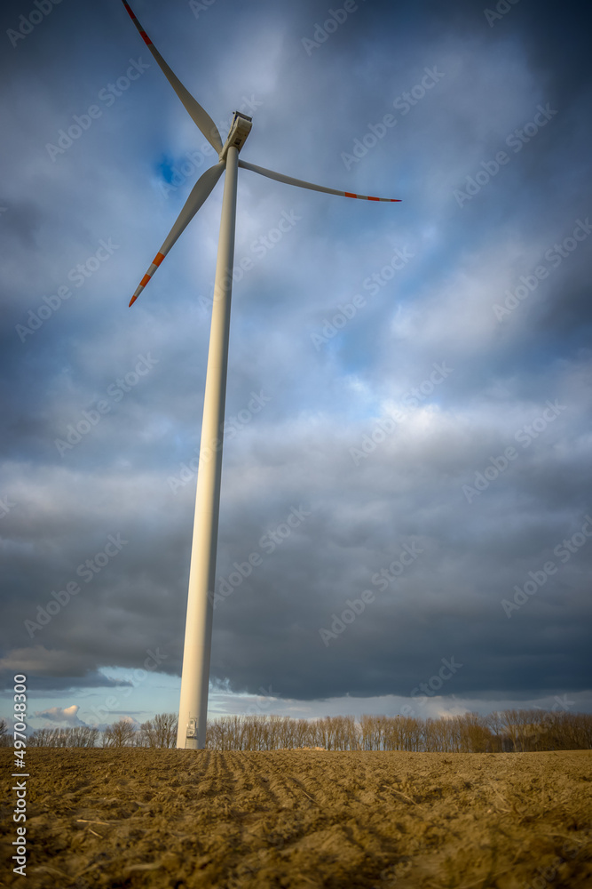 Fototapeta premium Electric wind turbine generating with blue sky and turbo generator