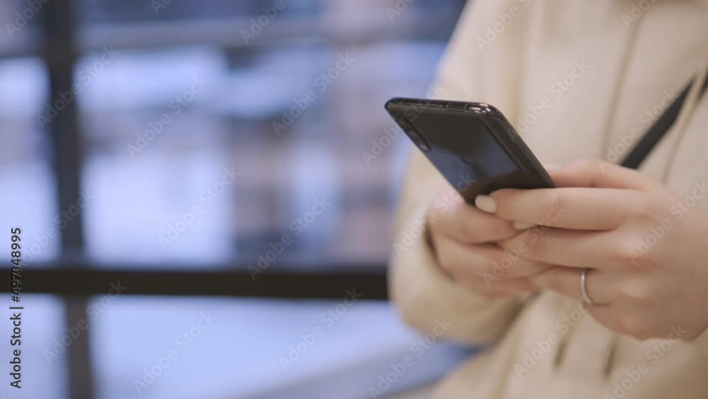 Hand of girl using texting mobile phone or chat. Close up of woman hand Hand of girl using texting mobile phone or chat. Close up of woman hand