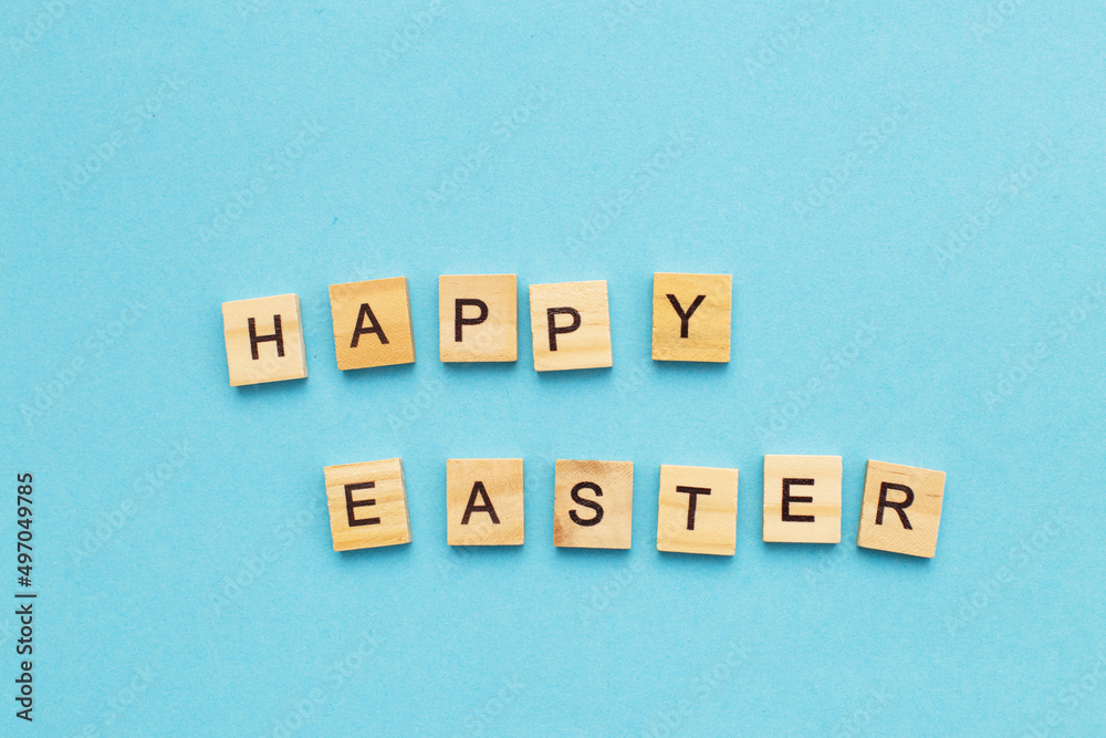 Obraz premium the inscription happy easter on blue background.