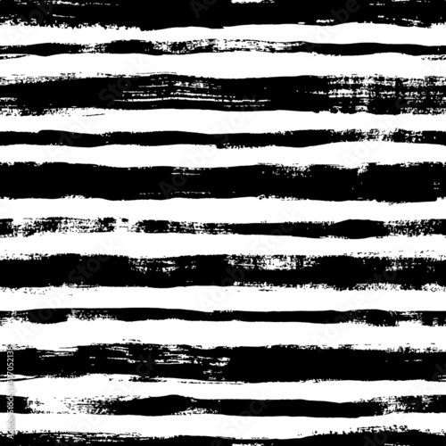 Bold horizontal line brush strokes seamless pattern. Hand drawn vector black lines with grunge texture. Modern fashion background. Grunge brushstrokes design. Ink illustration. Retro striped pattern 