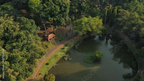 Aerial shot of Botanical Garden landscape in Peradeniya, Kandy, Sri-Lanka. Lake and trees in royal botanical garden Peradeniya, Sri Lanka.  photo