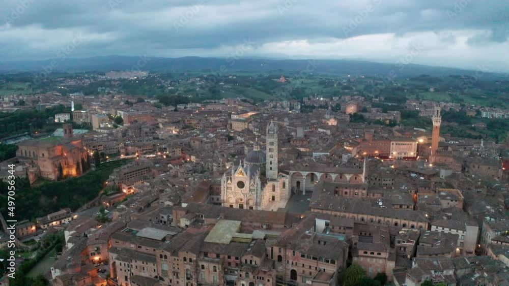 aerial view of Siena after sunset. lateral movement aerial view of Siena after sunset. lateral movement