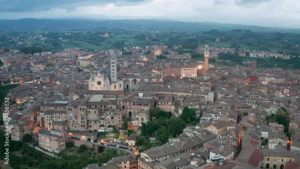 aerial view of Siena after sunset. lateral movement aerial view of Siena after sunset. lateral movement