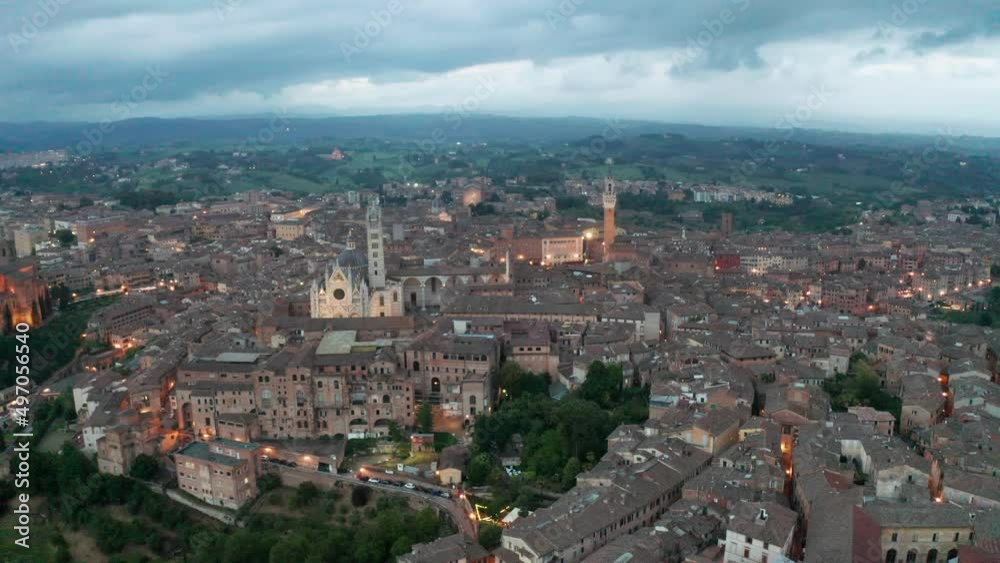aerial view of Siena after sunset. forward movement aerial view of Siena after sunset. forward movement
