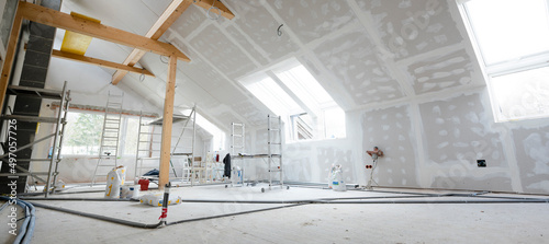 Fotografija Attic finishing construction site in the phase drywall spackling and plastering
