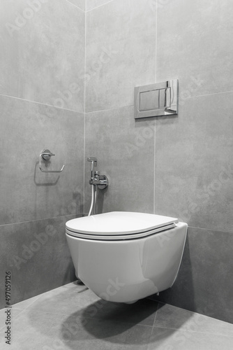 bathroom interior with white toilet and bidet photo