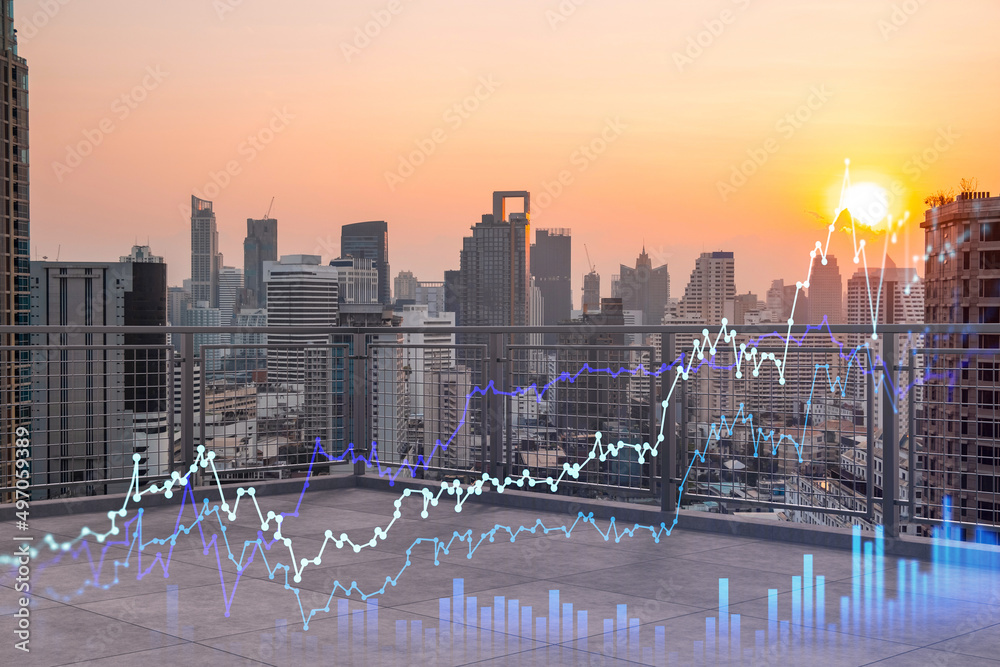 Obraz premium Rooftop with concrete terrace, Bangkok sunset skyline. Forecasting and business modeling of financial markets hologram digital charts. City downtown. Double exposure.