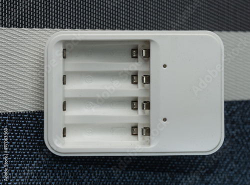 Obraz na płótnie Charger for four rechargeable batteries w salonie