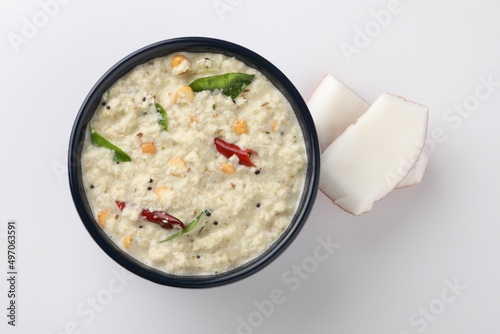 Indian food, chutney, Coconut chutney in a bowl with raw coconut ,Served with dosa, idli, vadai photo