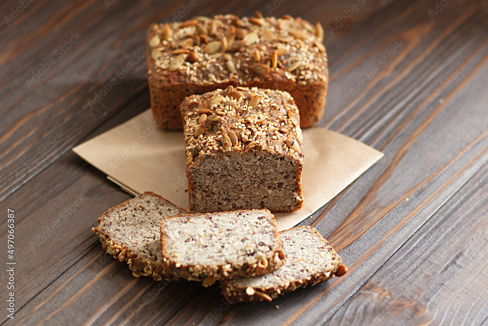 freshly baked bread with pumpkin, flax, sunflower seeds on a rustic wooden table freshly baked bread with pumpkin, flax, sunflower seeds on a rustic wooden table