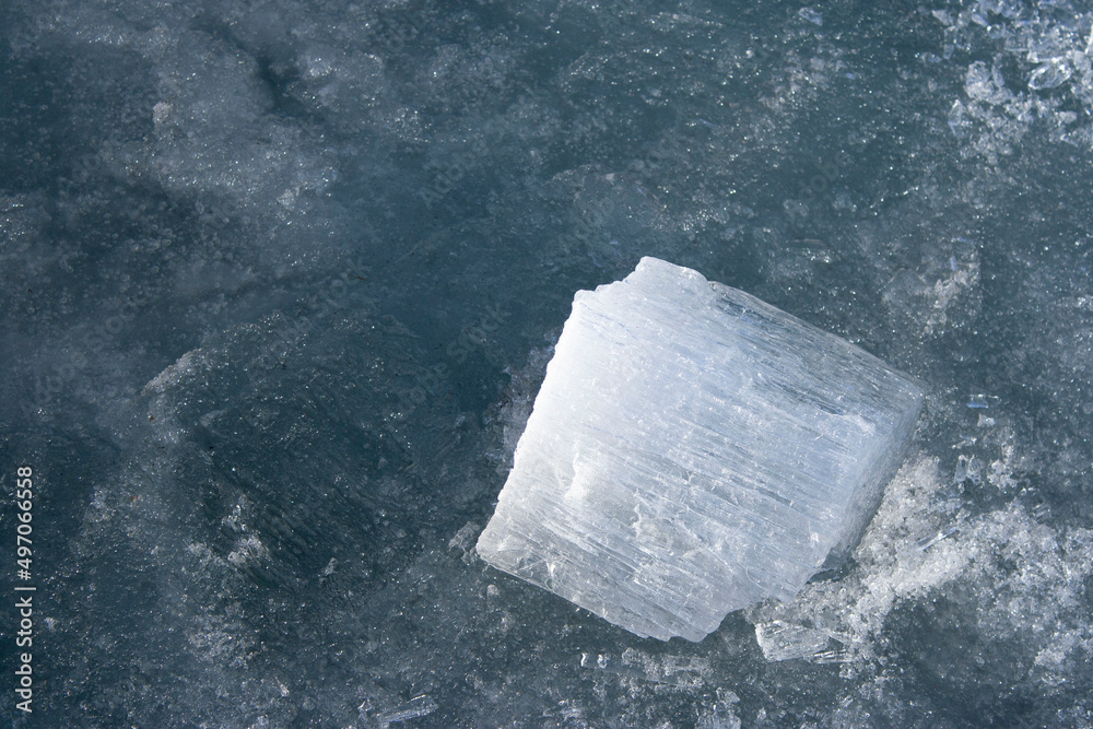 The texture of the ice is close. Lake Baikal in winter. Fresh water reserves of planet Earth. Global warming. The texture of the ice is close. Lake Baikal in winter. Fresh water reserves of planet Earth. Global warming.