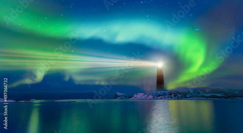 Canvas Print Northern lights (Aurora borealis) over lighthouse seaside in winter