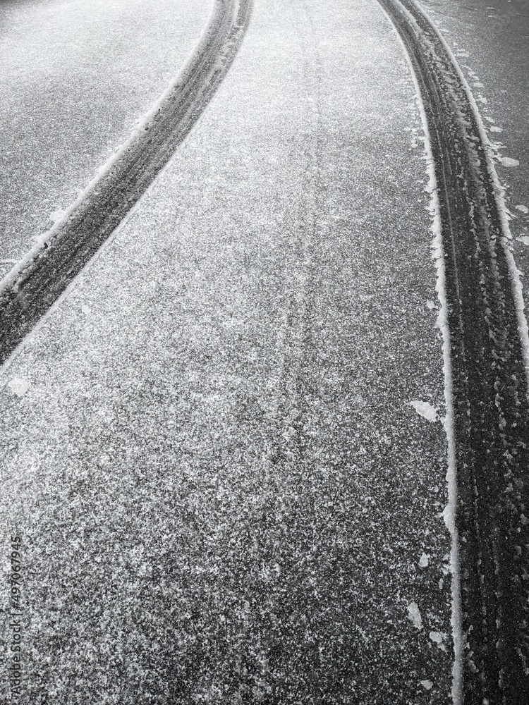 Fototapeta premium Winter road snow tire trace