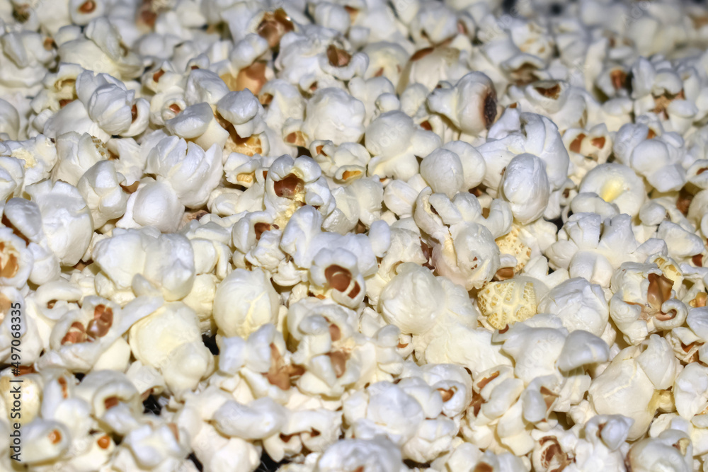 Popcorn in a plastic bag as a background. Close-up