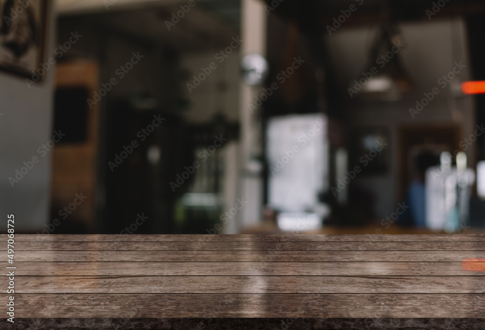 Empty wooden table top with lights bokeh on blur restaurant background. Empty wooden table top with lights bokeh on blur restaurant background.