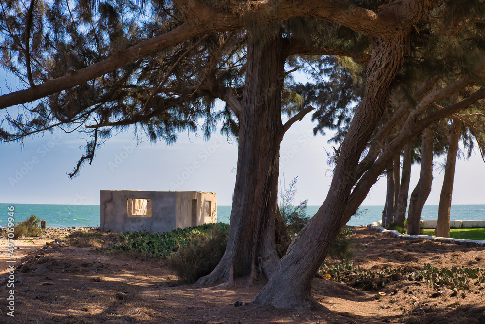 Unfinished clay hut at Gambian beach in sunset Unfinished clay hut at Gambian beach in sunset