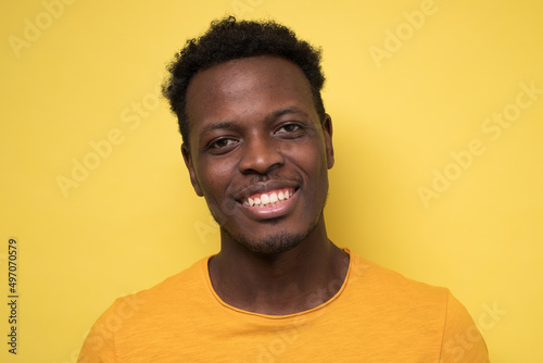 Smiling african man ooking at camera. Portrait of black confident man. photo