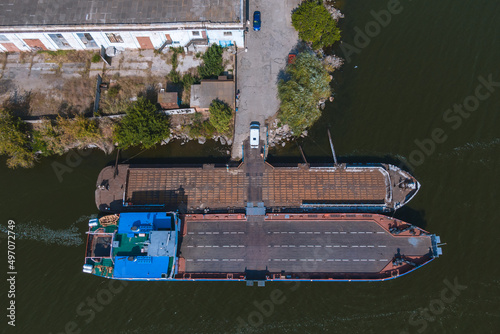 Nikopol river port from above. Photo of barges in the water. Summer sunny day. © Denis Chubchenko