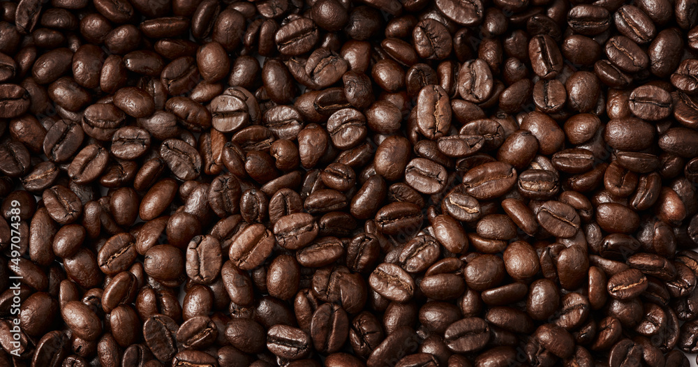 Roasting brings out the aroma and flavour locked inside beans. Closeup shot of coffee beans. Roasting brings out the aroma and flavour locked inside beans. Closeup shot of coffee beans.