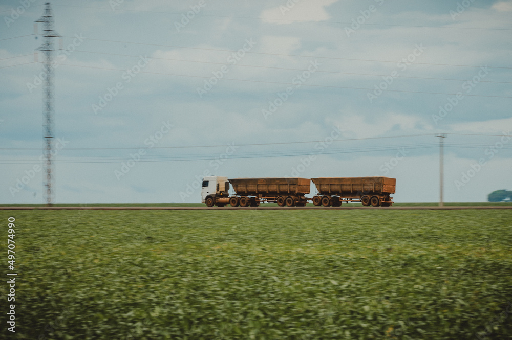truck on the field of soybean plantation