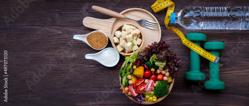 Diet and Healthy life loss weight exercise Concept. Fresh vegetable salad with Weight scale measure prevention for women diet slimming. Lifestyle Time and Healthy, copy space for banner